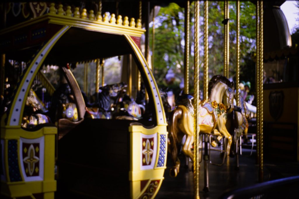 A golden Carousel with sunset light reflecting on it