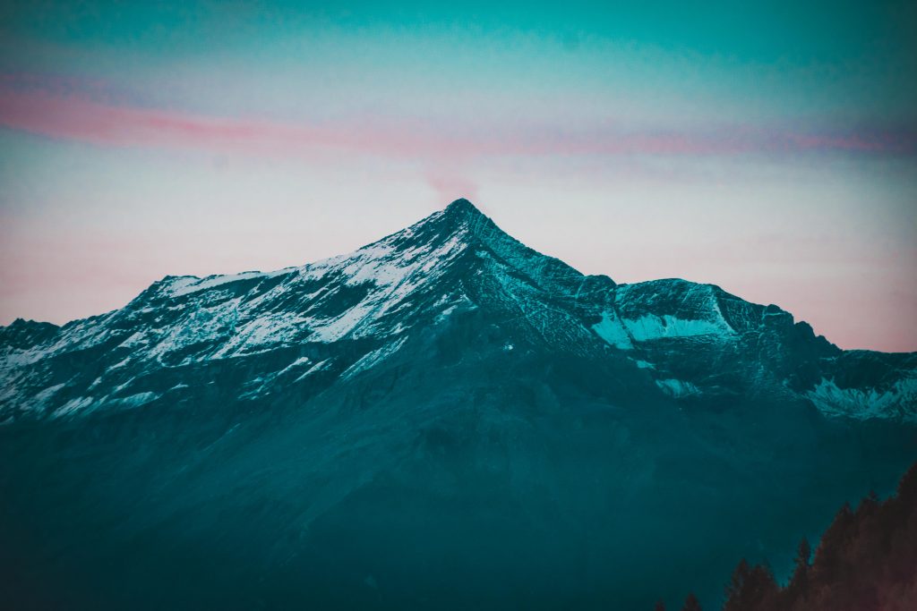 The view from one of the houses: the peak of mountain Rocciamelone, standing on the other side of the valley and seen at dusk with pink clouds around it